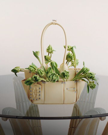 Yellow Posy bag on glass table